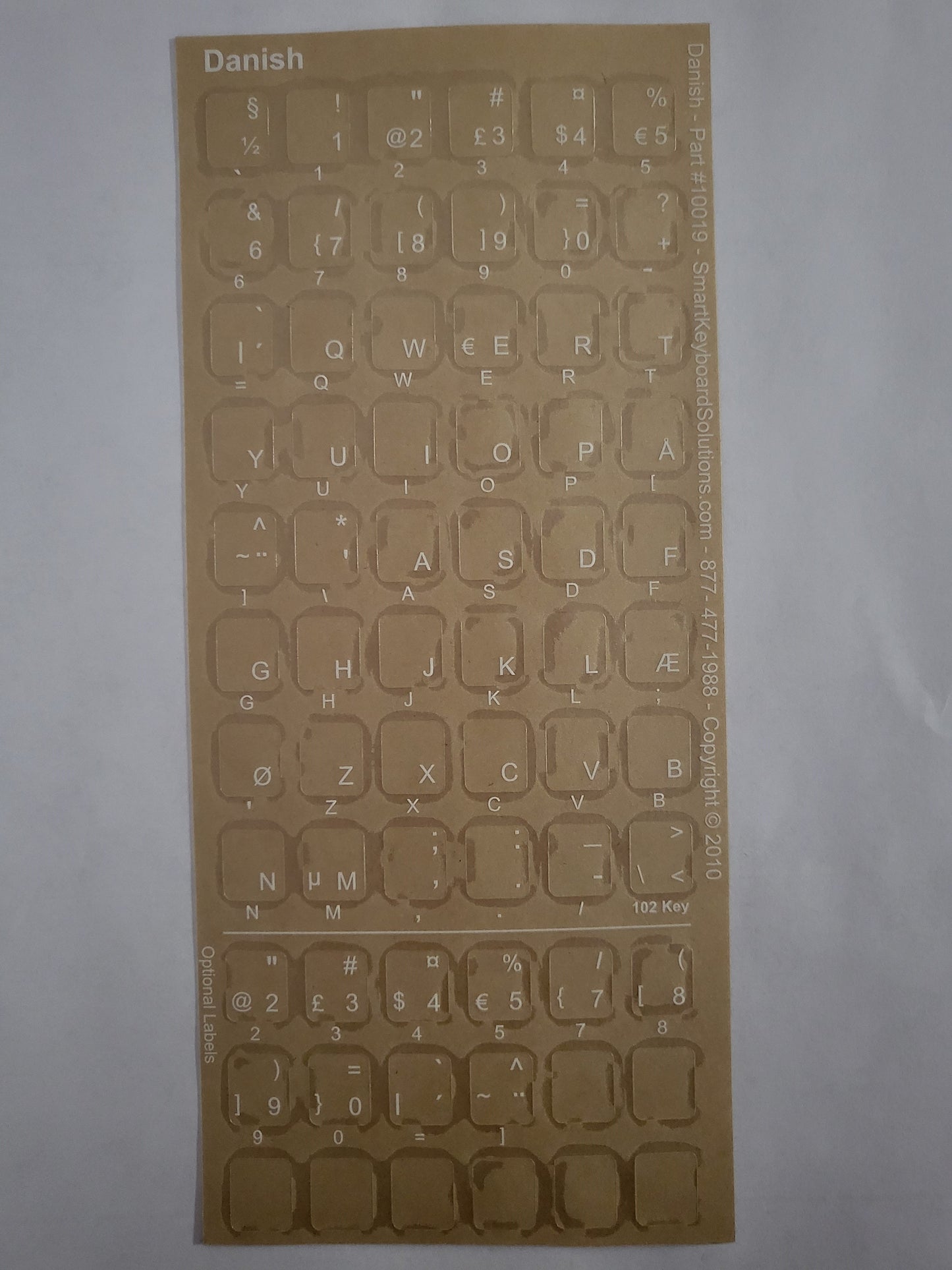 Transparent Danish keyboard label set with light letters on key layout sheet