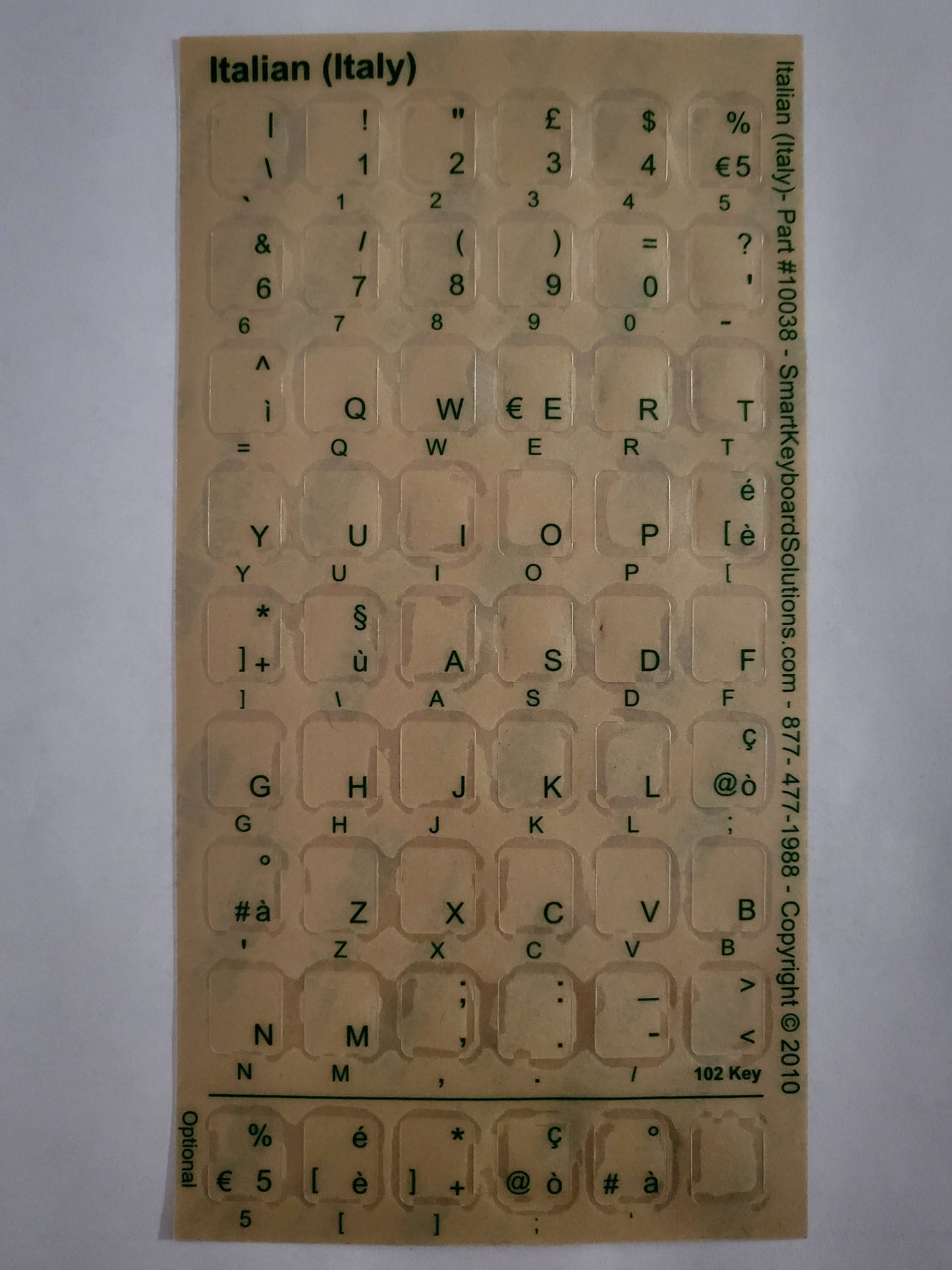 Clear keyboard label sheet with cutout letters and symbols for Italian (Italy) keys